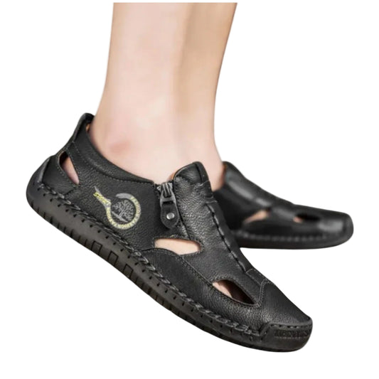 Black sandals with open-toe design on a white background