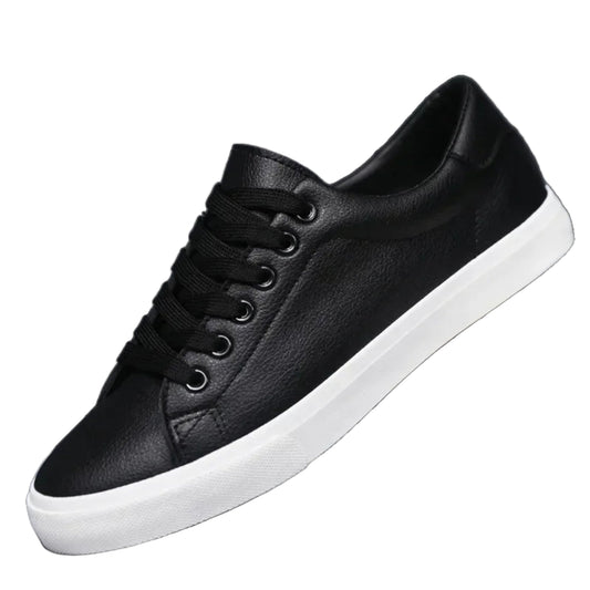 Black leather sneaker with white sole on a white background