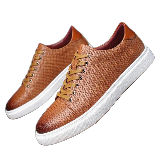 Brown leather sneakers with white soles on a white  background