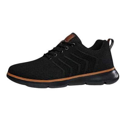 Black athletic shoe with brown accent on a light gray background