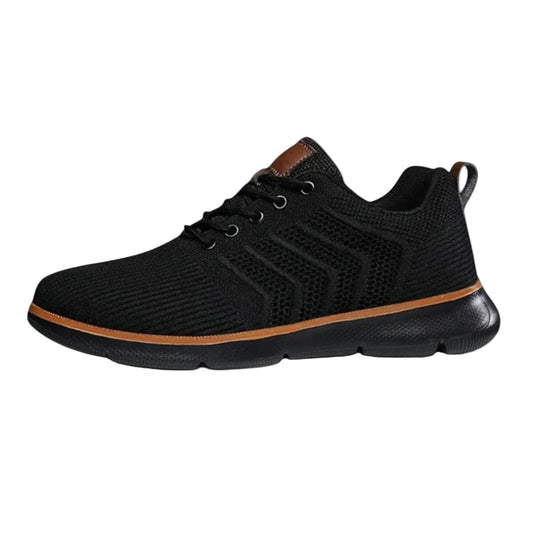 Black athletic shoe with brown accent on a light gray background